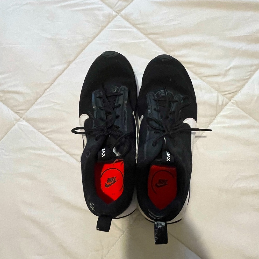 Black Nike running shoes, brand Nike, color black, size women’s 8